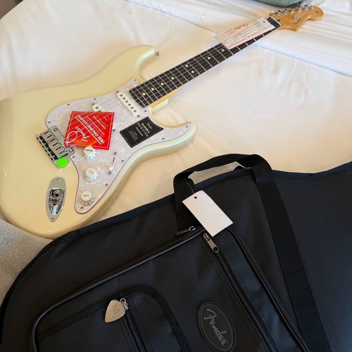 Guitar used by Keonho of CORTIS: a Fender Player II Modified Stratocaster in Olympic Pearl with a rosewood fingerboard, new with tags and its Fender gig bag