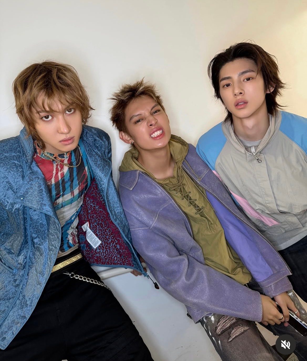 Martin of CORTIS on the left in the Jean Paul Gaultier mesh top and PUMA x MIHARA YASUHIRO nylon jacket backstage with two members