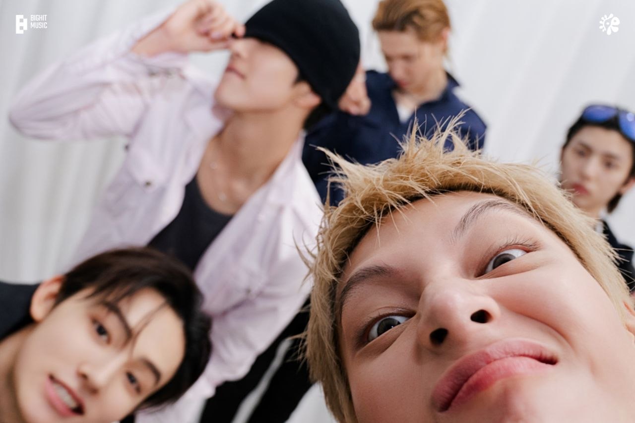 The five members of CORTIS messing around in front of the camera