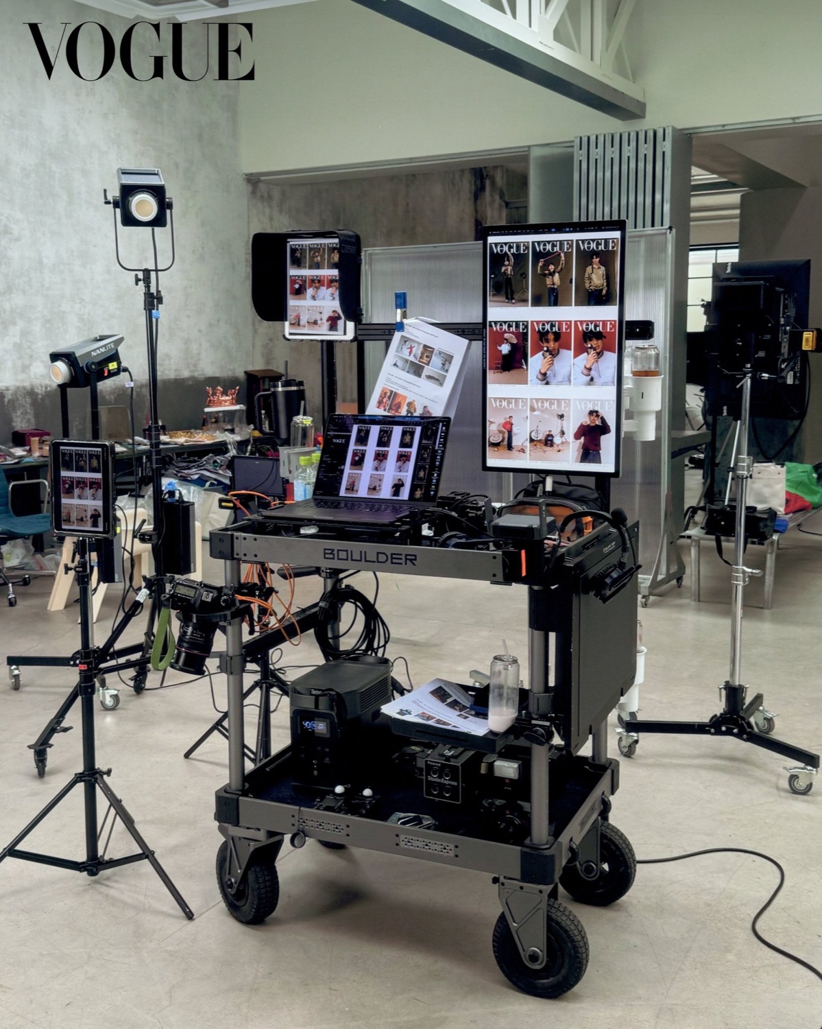 Behind the scenes of the Vogue Korea shoot: the digital tech cart with monitors showing Seonghyeon of CORTIS cover layouts