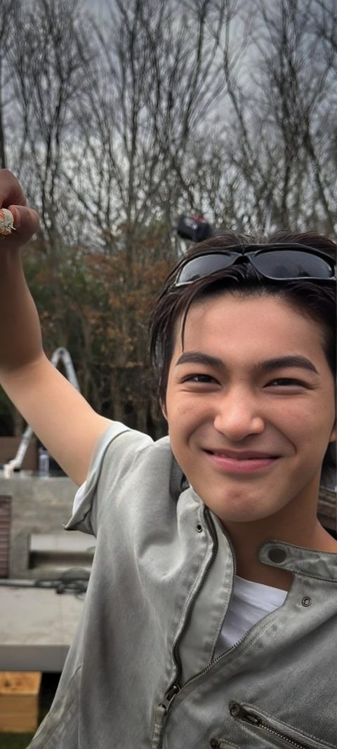 CORTIS Keonho phone wallpaper, smiling outdoors with sunglasses pushed up